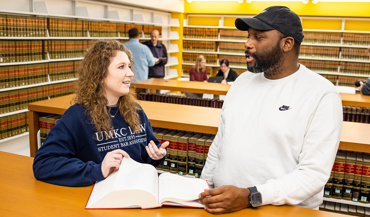 Students talking in library